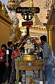 Yangon Myanmar. Shwedagon Pagoda (the Golden Stupa). Locals pray at the station around the base of the pagoda that represents the day they were born.  